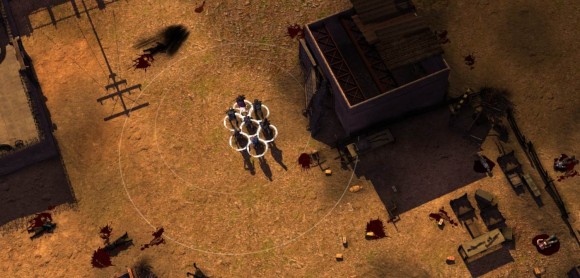 Desert Rangers standing amidst a settlement. The ground is littered with corpses.